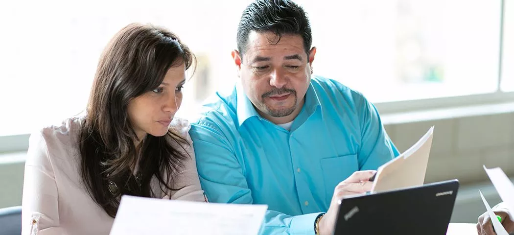 Two teachers looking at schoolwork