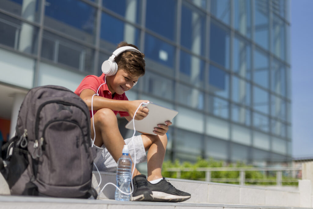 boy reading on tablet