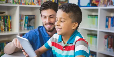 Teacher and student with a tablet computer