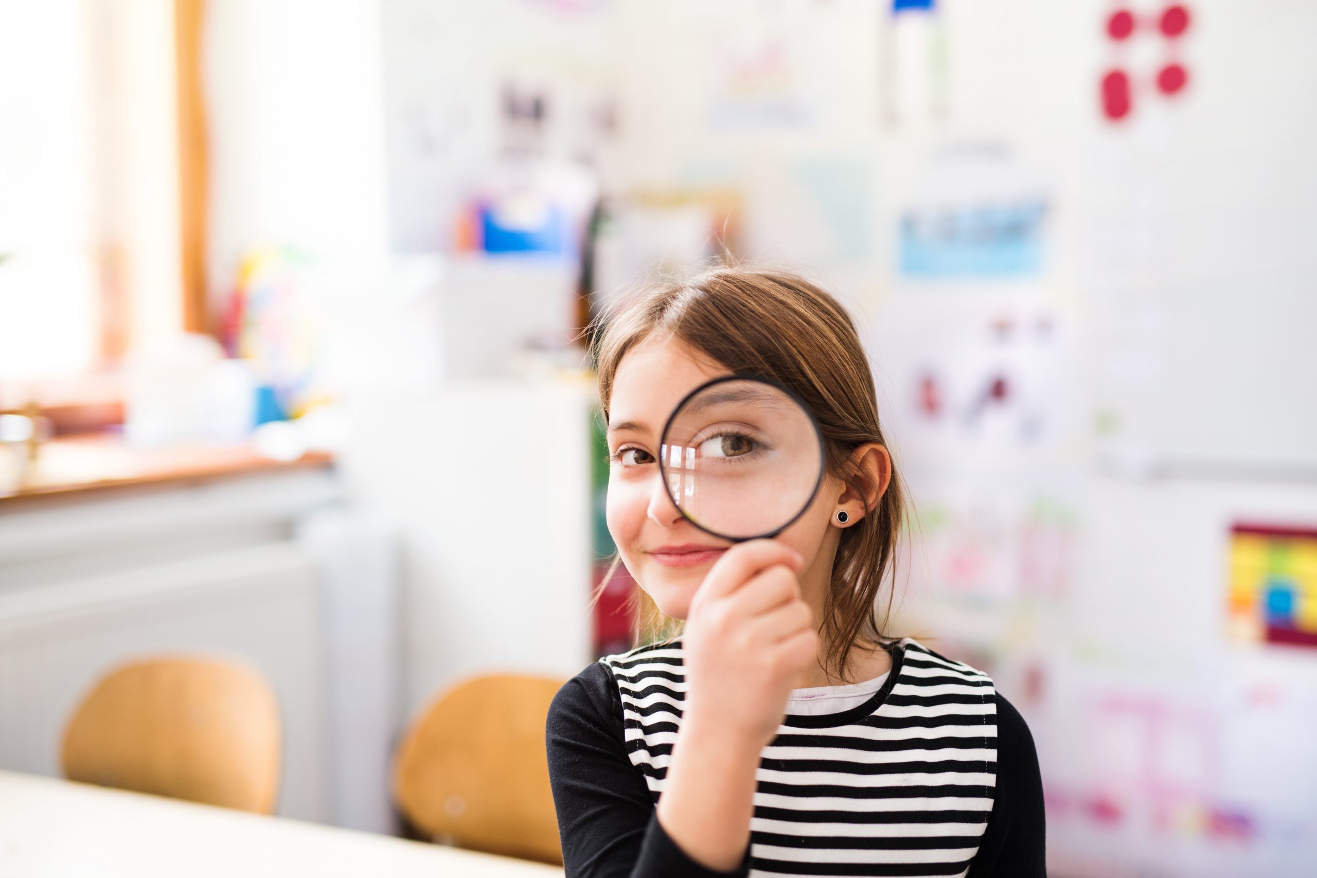 Girl with magnifying glass
