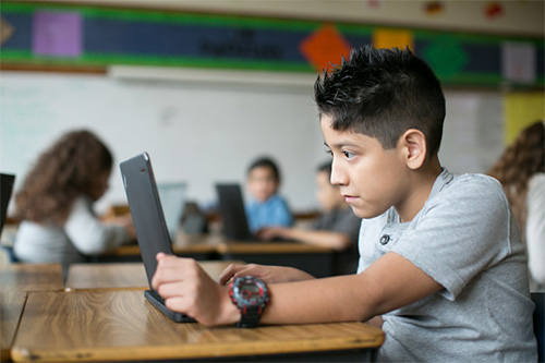 Boy working on computer