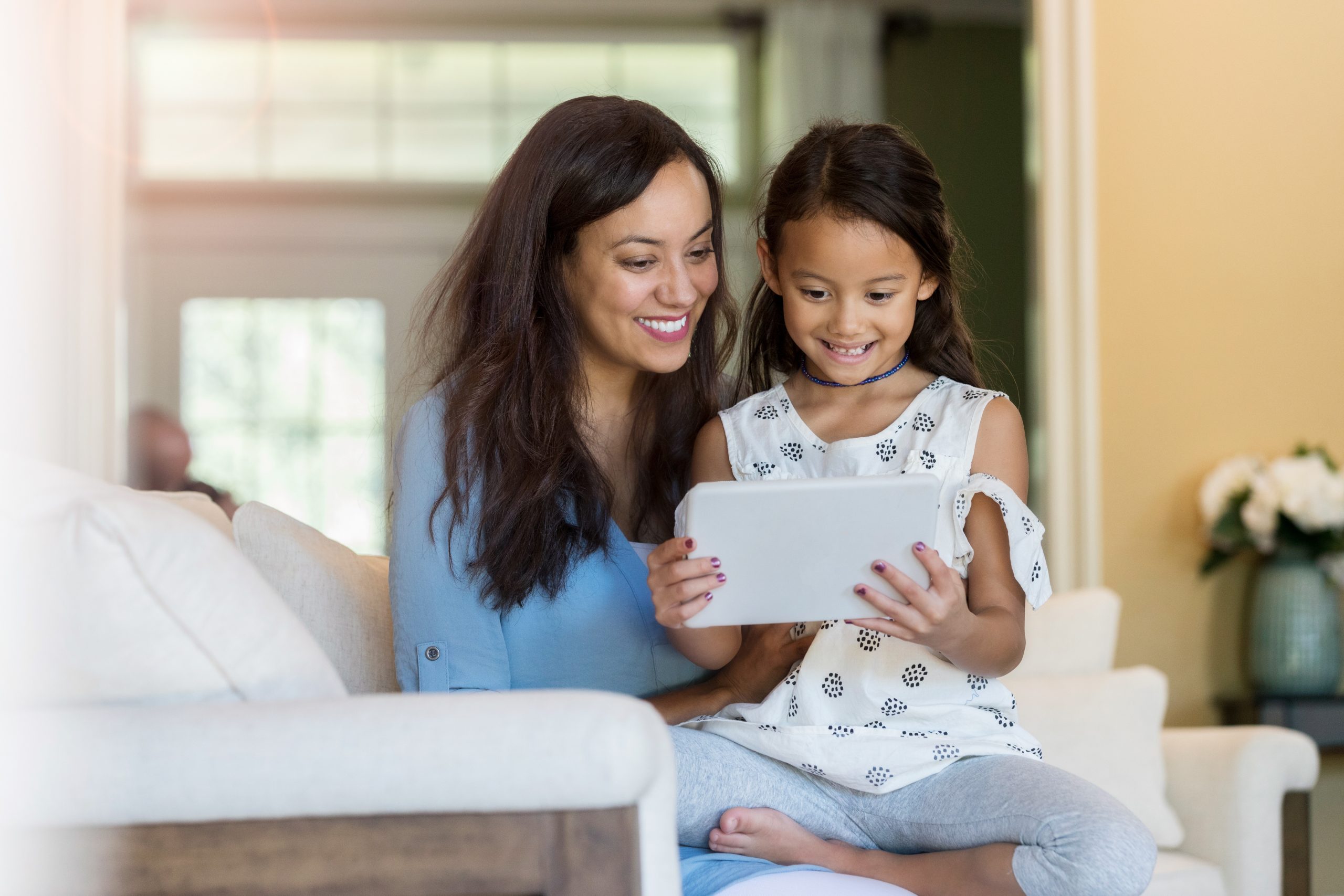 parent and child on iPad