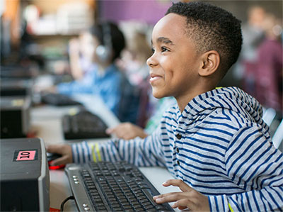 Boy on desktop computer
