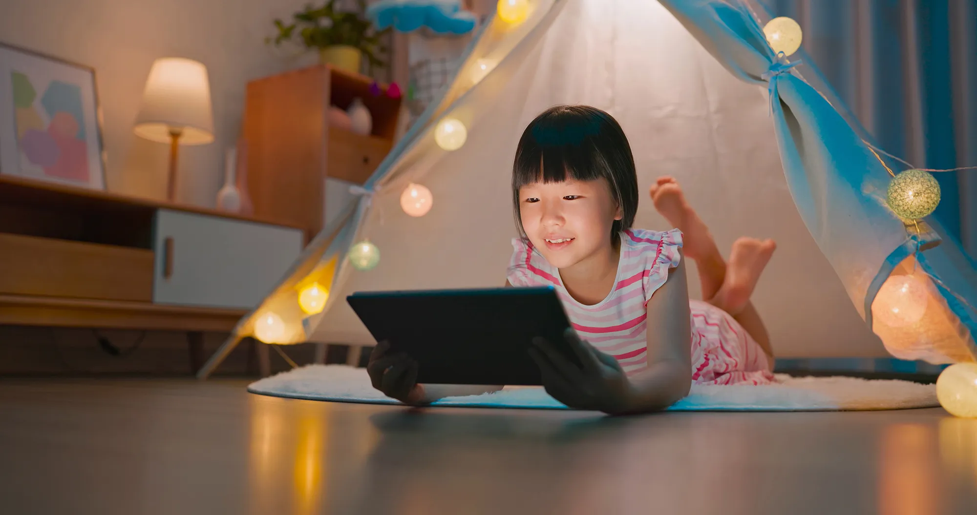 Girl reading on a tablet
