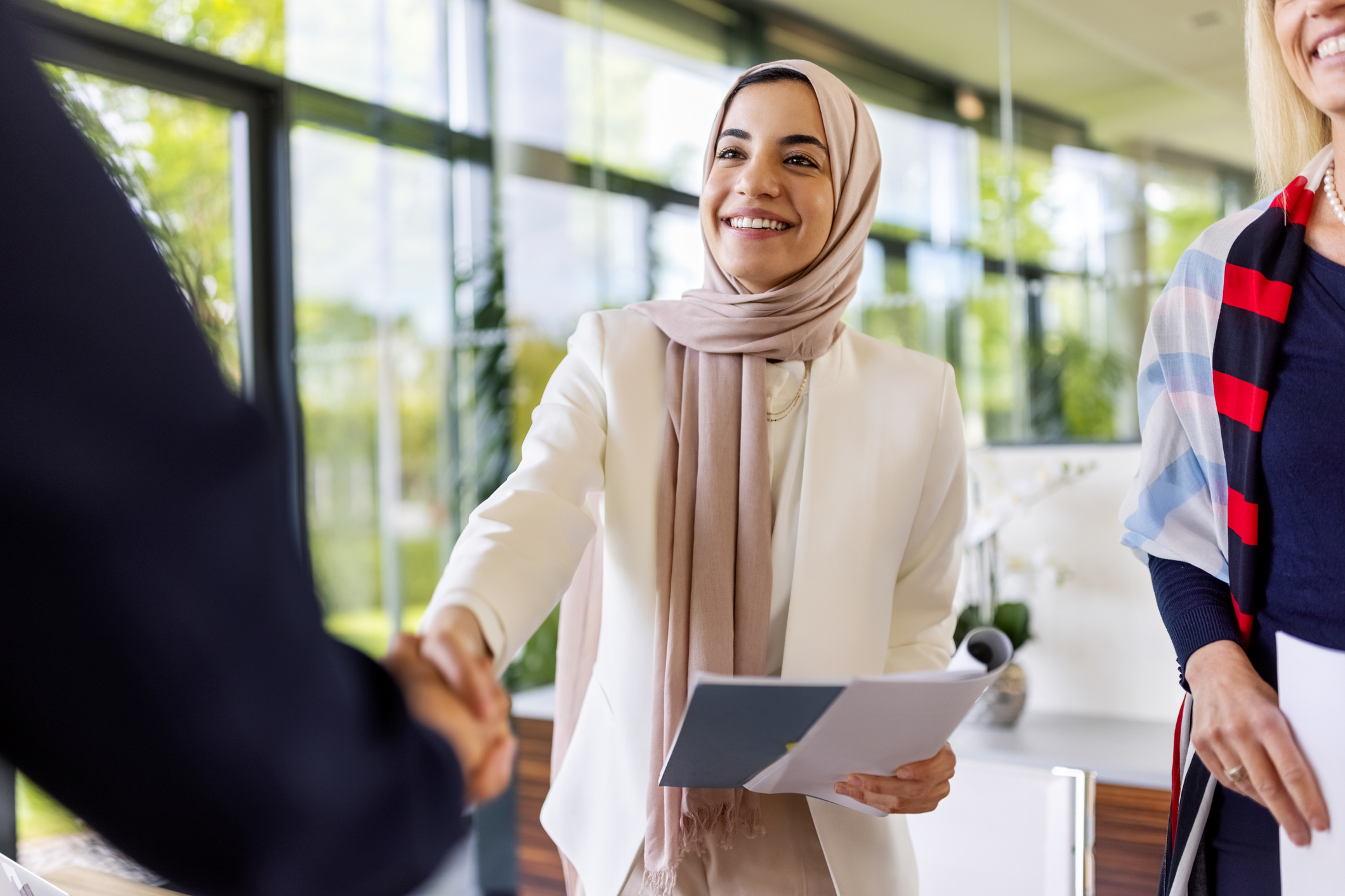 young woman shaking hands