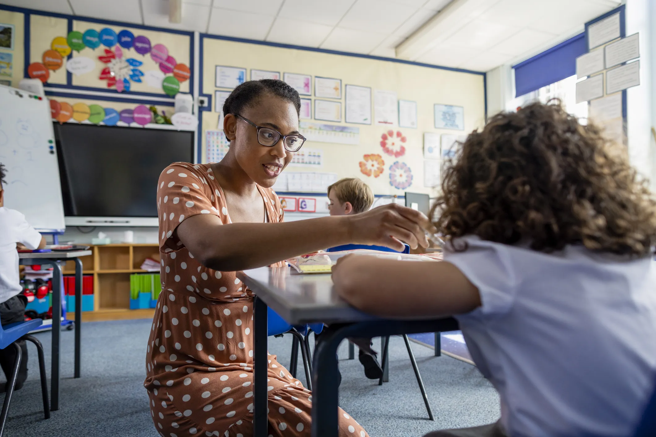 Teacher Supporting a Student