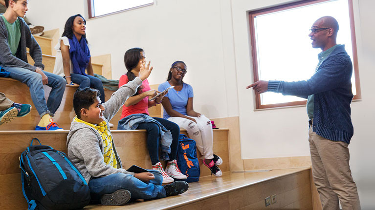 Teacher with students on risers.