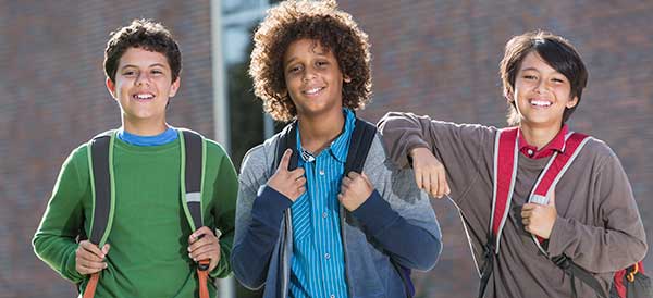 3 boys with backpacks