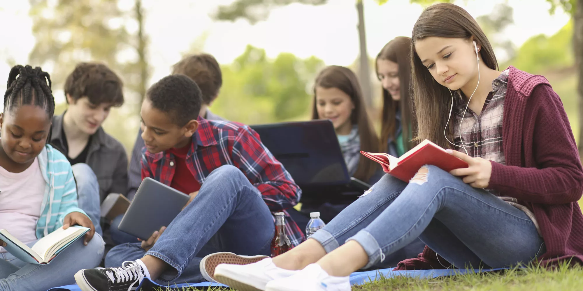 Students studying outside of a school
