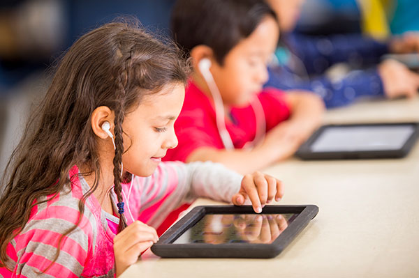 Kids studying on tablets