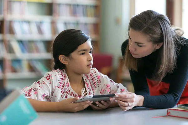 A teacher and her student using Renaissance in a classroom