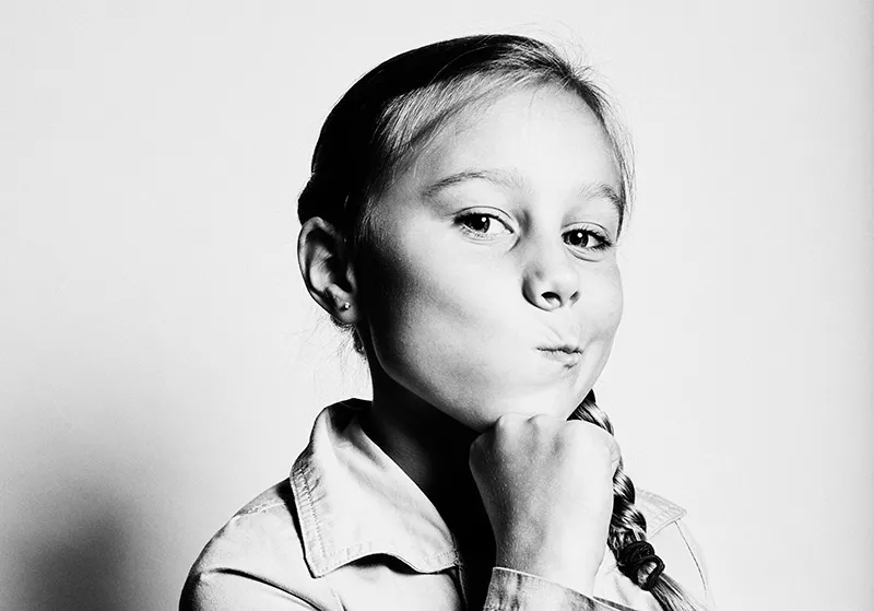 Black and white photo of girl making a funny face