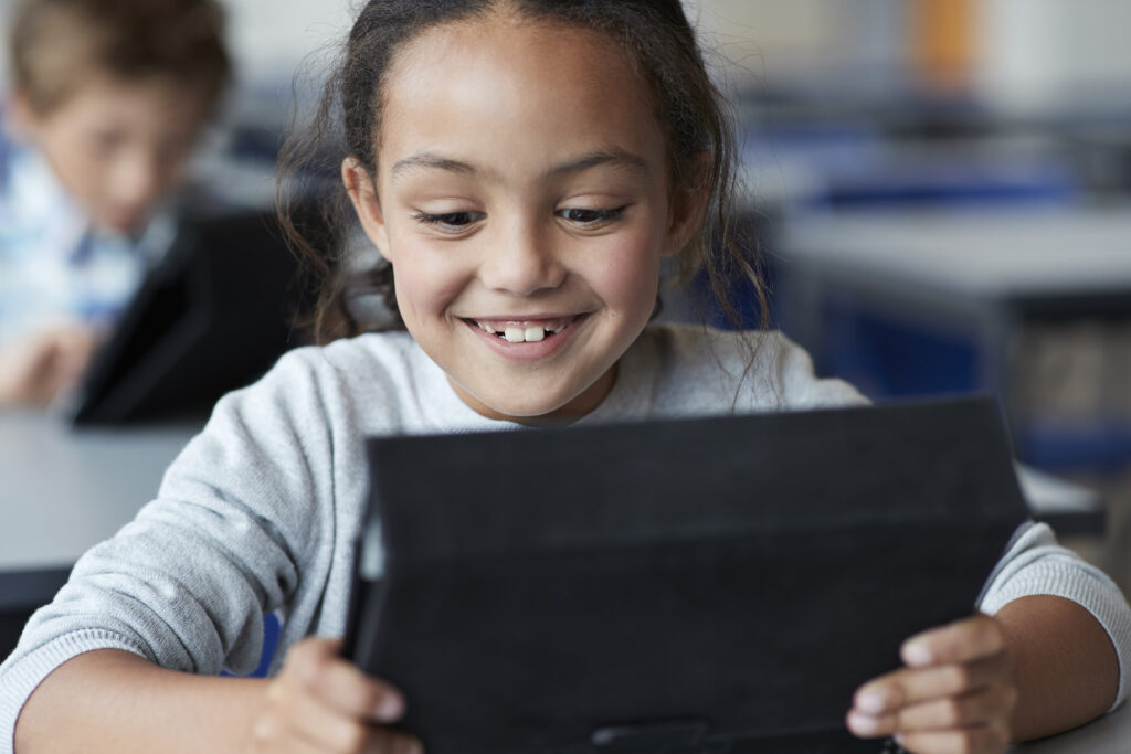 happy girl on tablet