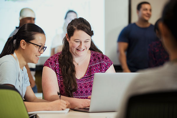 Teacher and student on computer