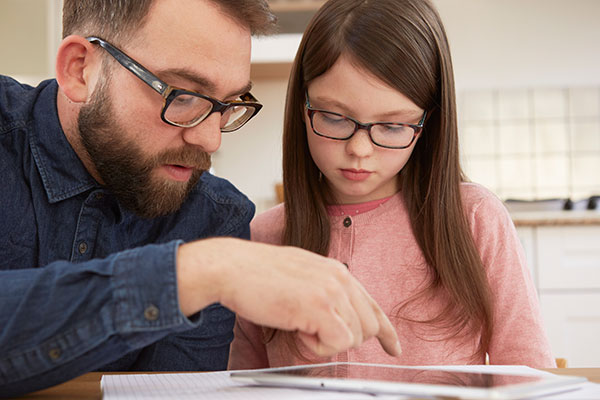 Teacher working with girl