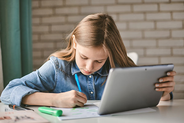 Girl doing work with a tablet