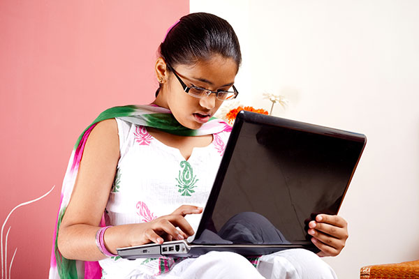 Girl studying on laptop