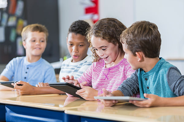 Group of students using tablets