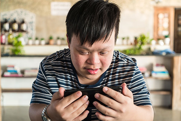 Boy with special needs on tablet