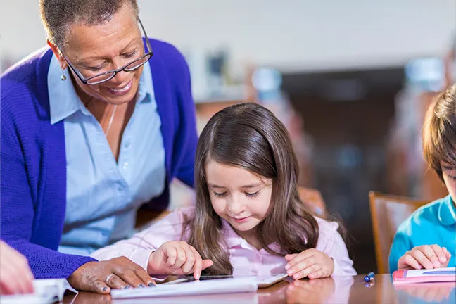 educator helping student