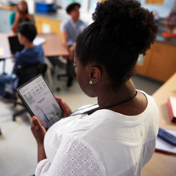 Teacher looking at tablet