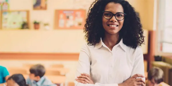 Female teacher in front of her classroom