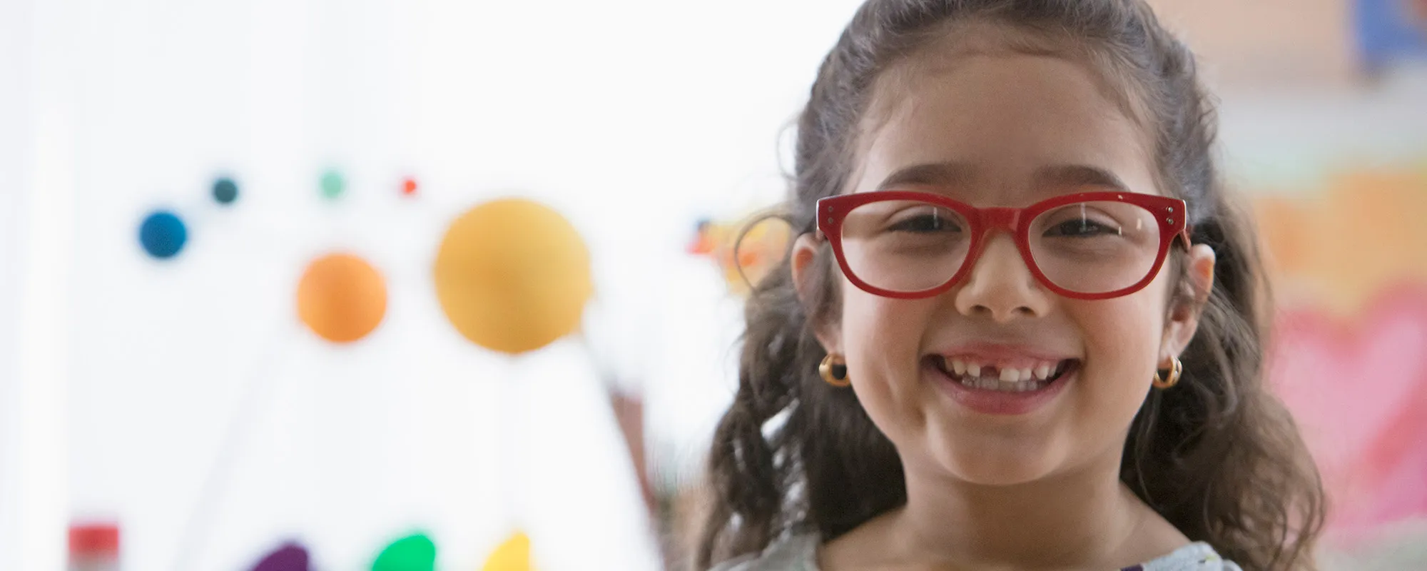 Young smiling girl in a classroom