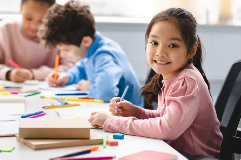 A teacher working with a young student