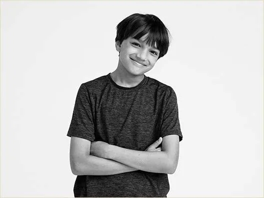 Boy with arms folded