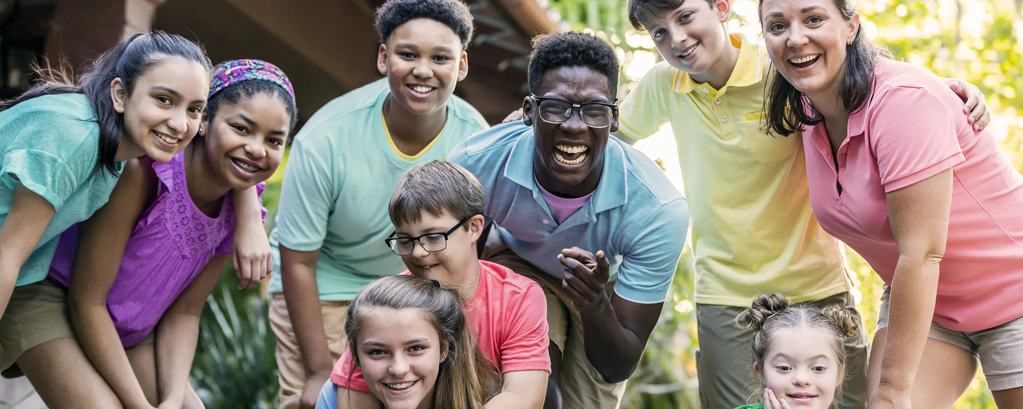 A group of teenage students at an outdoor event