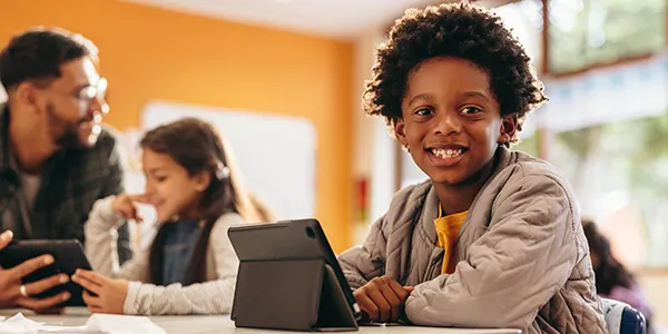 Young male student using a tablet