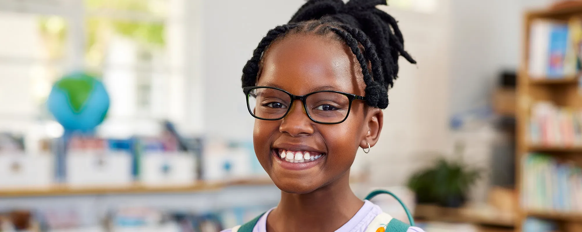 Smiling girl in a classroom
