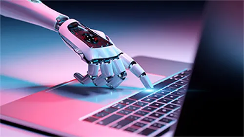 A robot using AI on a computer