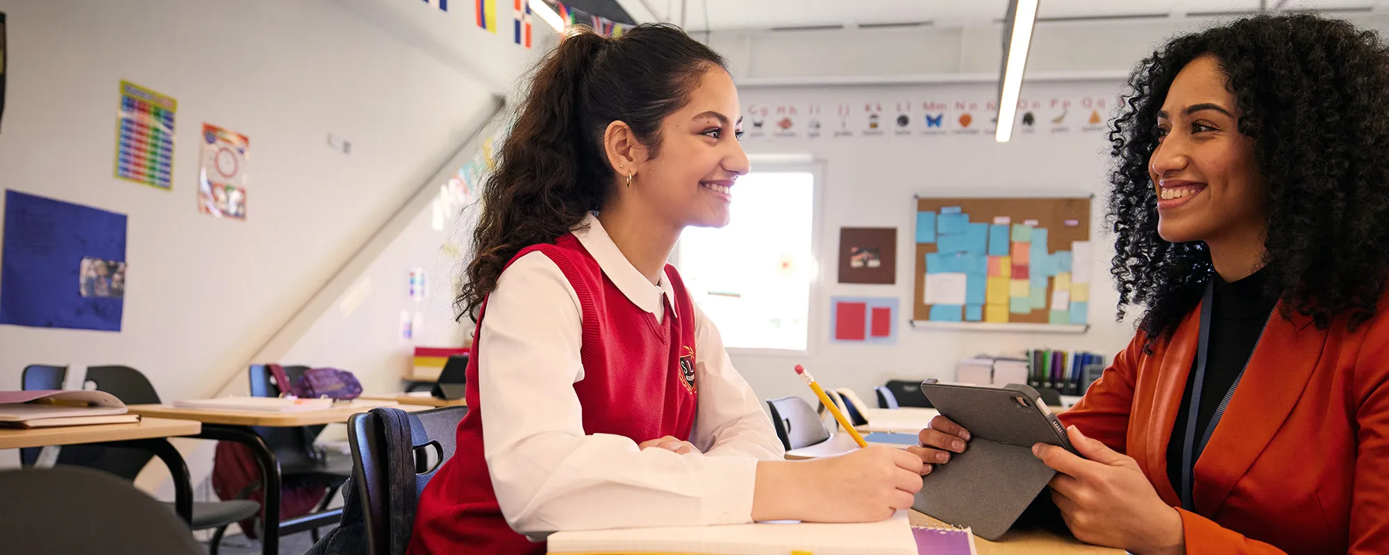 A teacher demonstrating artificial intelligence technology in her classroom