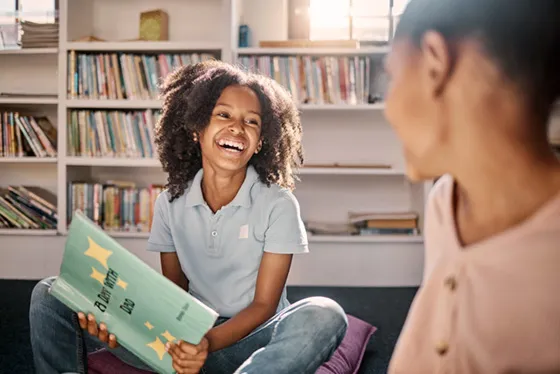 Elementary school girls reading in a school library
