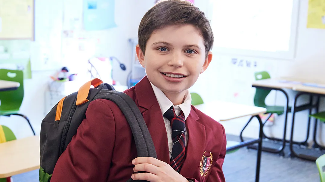 A girl in a classroom using digital technology