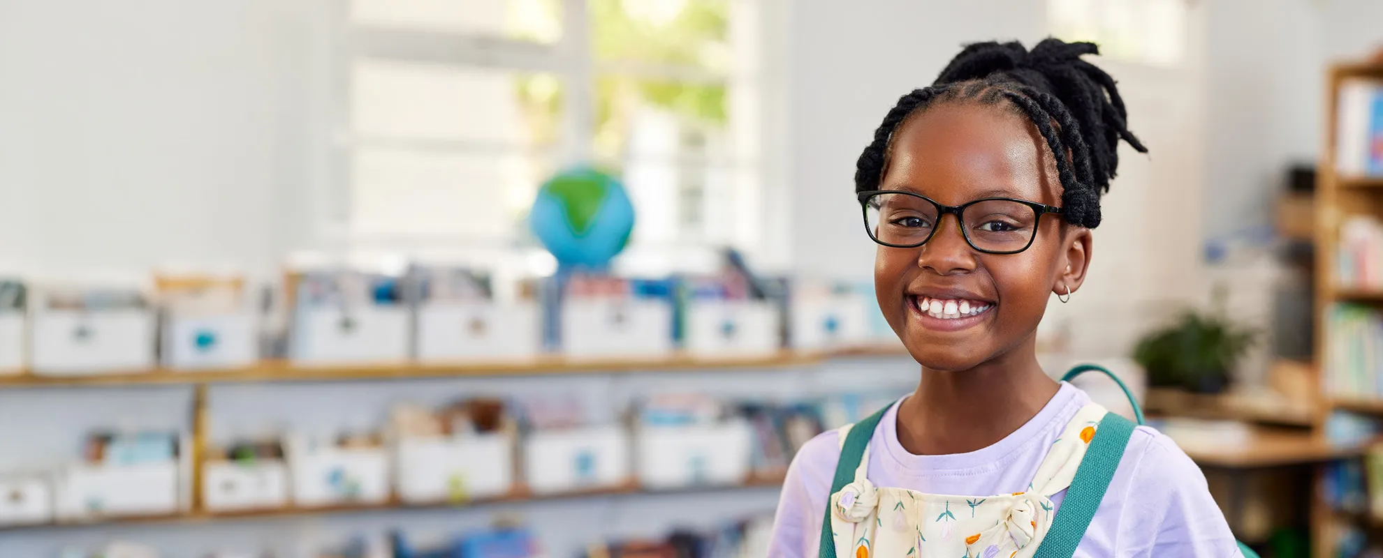 Smiling girl in a classroom