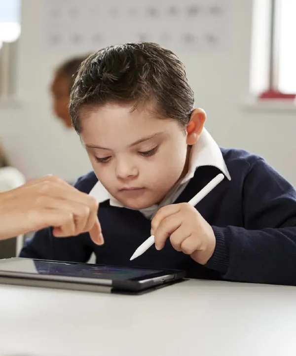 A preschool aged boy working on a digital tablet