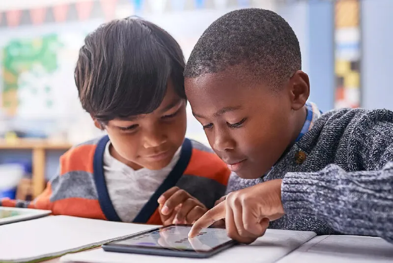 two boys focusing on a lesson