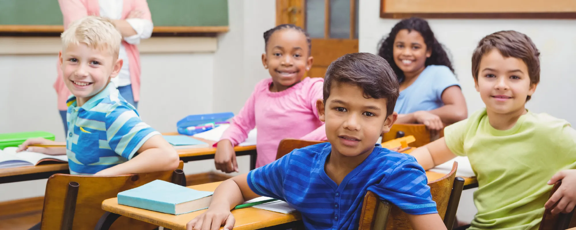 a classroom of students looking at the camera
